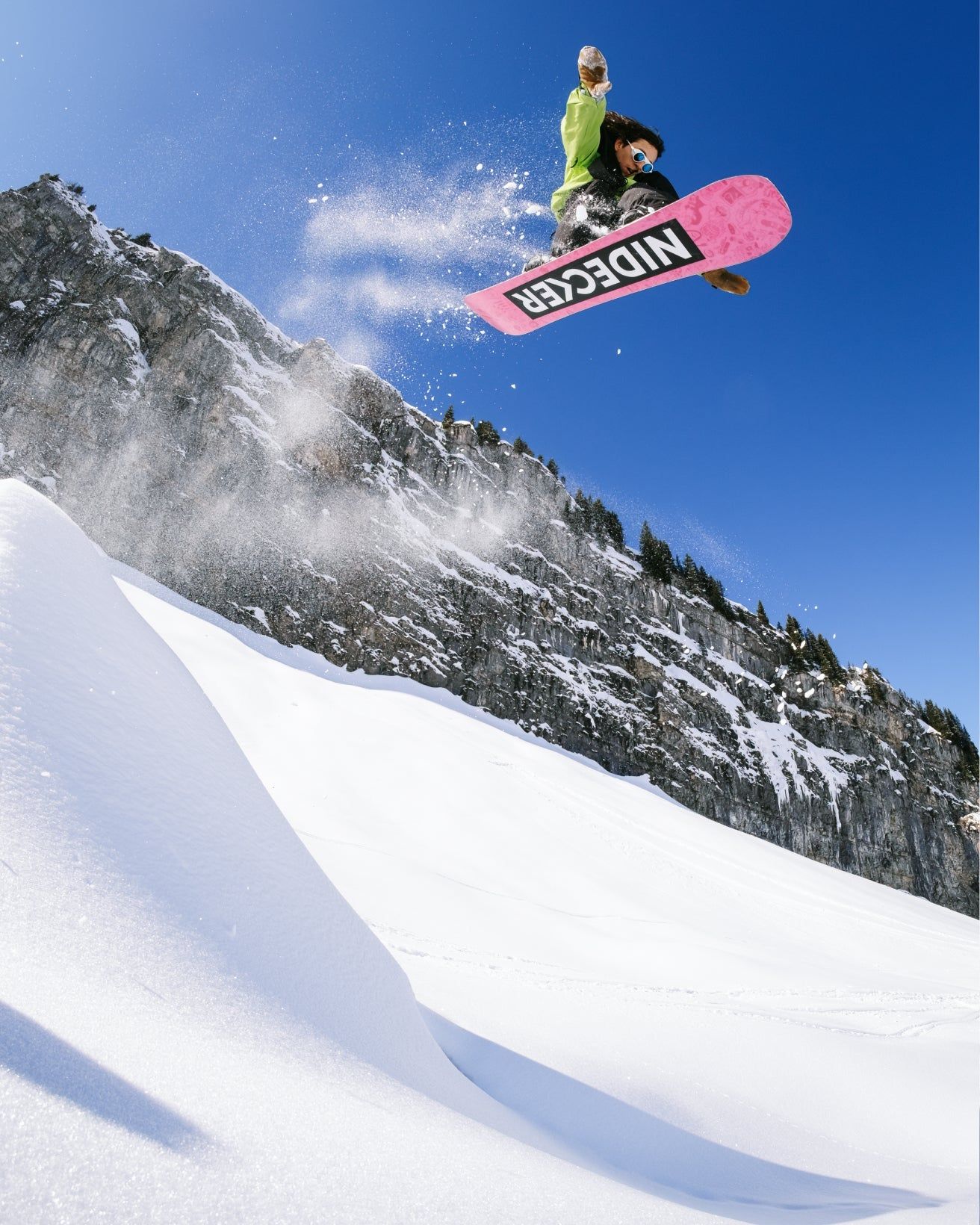 Nidecker 2027 snowboard range campaign image on a powder slope
